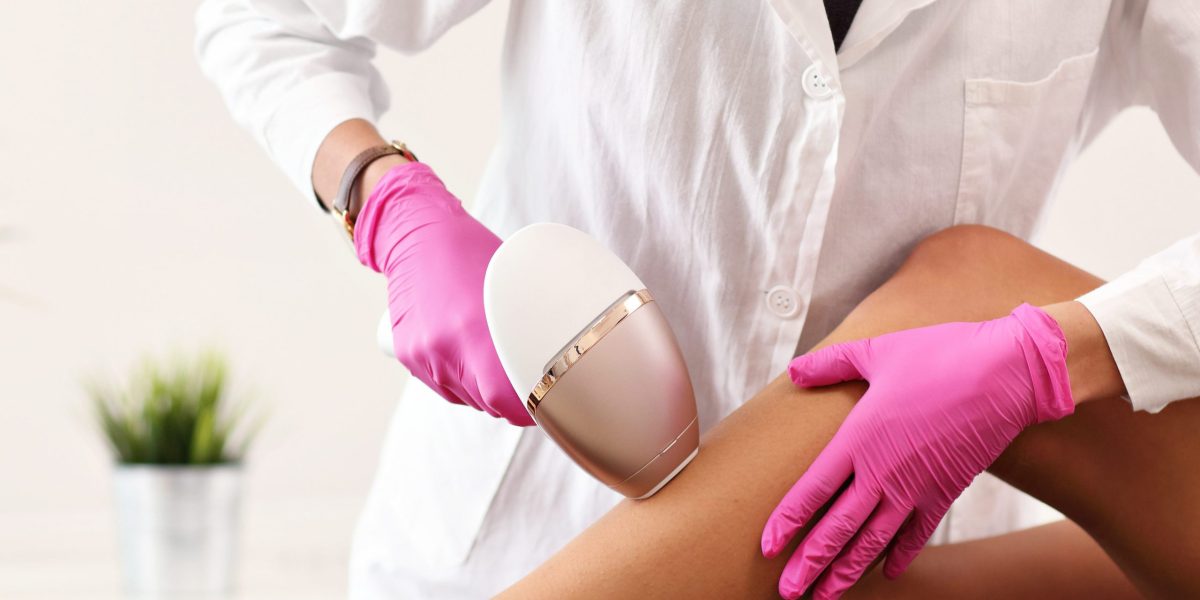 Picture of adult woman having laser hair removal in professional beauty salon